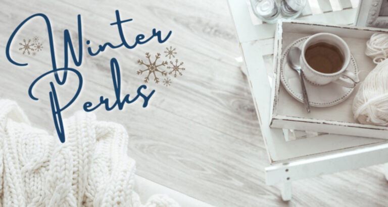 Photo of a white bench with a small white tray on it holding a mug filled with hot cocoa and text that says "Winter Perks" in a cursive font